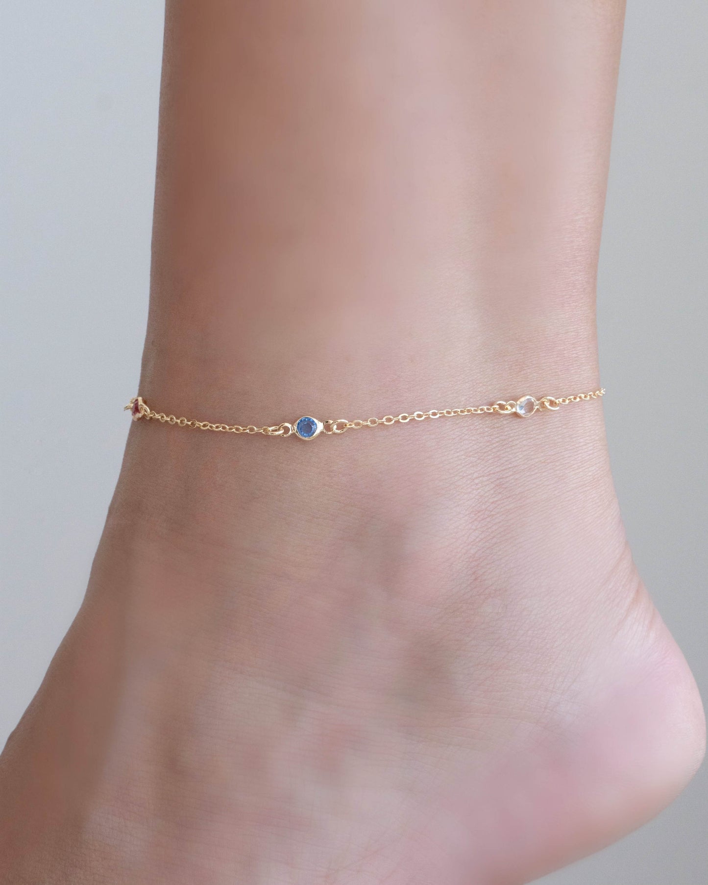 Bracelet de cheville avec points lumineux colorés et plaqué or